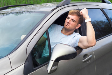 Angry aggressive guy, young emotional irritated man driver displeased, dissatisfied, frustrated...