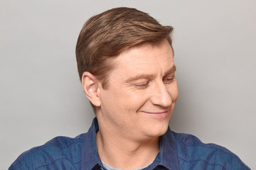 Obraz premium Portrait of blond mature man with happy expression and smiling