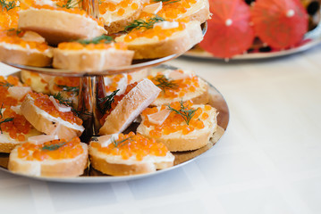 Snacks for the festive table, sandwiches with caviar.