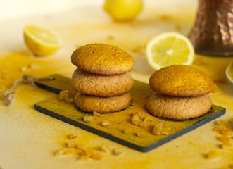 Homemade cinnamon cookies with cinnamon powder lemon and citron. Minimal food background