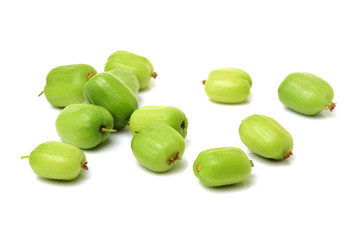 mini kiwi baby fruit (actinidia arguta) on white background 