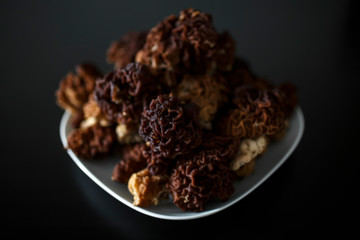 mushrooms on a plate on a black background