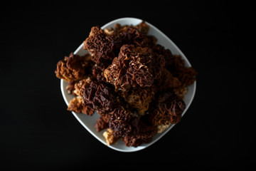 mushrooms on a plate on a black background