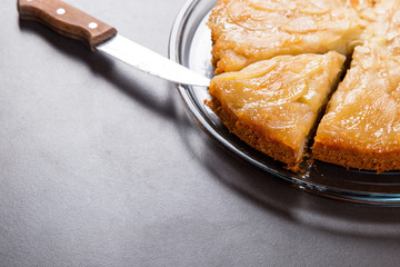 Homemade apple pie on a stone countertop. Appetizing breakfast, author's recipe.