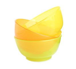 Stack of plastic bowls isolated on white. Serving baby food