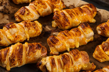 Homemade pastries, sausages in the dough with their own hands, appetizing and simple recipe.