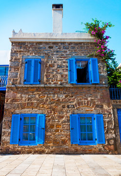 BODRUM, MUGLA, TURKEY. Traditional Bodrum House with blue windows.