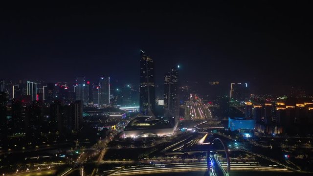 night illumination nanjing city international youth cultural center district pedestrian bridge aerial panorama 4k china