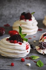 Berry Pavlova Cake dessert on the grey background