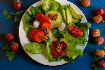 Green salad with sweet tomato, bright colors for fit people and who eat nutritious