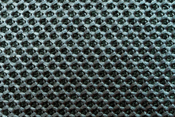 Fragment of a sample of woven synthetic material. Water-repellent fabric with a repeating pattern. Modern technologies. Background or backdrop