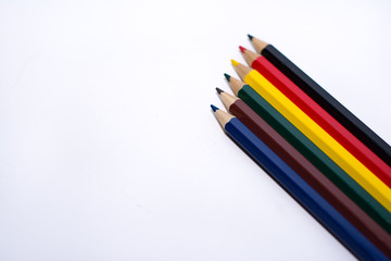 colored pencils on white background