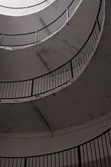 old and dirty car parking area with spiral stairs walking road