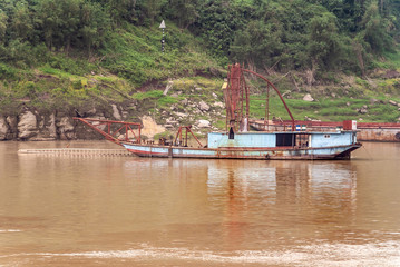 Huangqikou, Chongqing, China - May 8, 2010: Yangtze River. inactive light blue dredging vessels...
