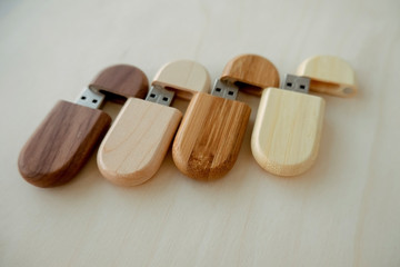 set of wooden brown usb flash drive, wooden packaging. Light and dark wood, data storage, beautiful...