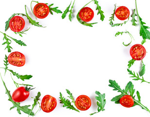 Frame made of halved cherry tomatoes and rucola leaves isolated on a white background. Copy space. Top view.