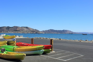 Kayaks stored near the Port San Luis Pier, Avila Beach, California