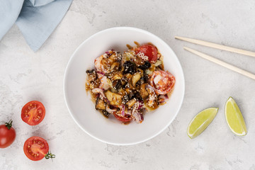 Rice with shrimp, squid, fresh tomatoes and onions. Asian recipe.