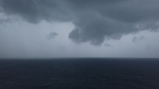 Stormy clouds over dark ocean
