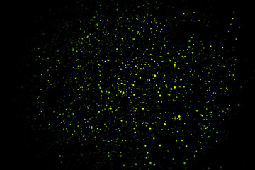 Abstract dust explosion and flash with illumination on a black background.