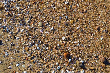 small stones on the beach with a sunshine day