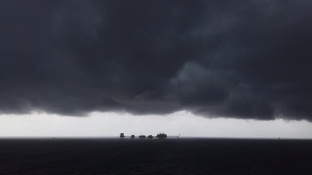 Central processing platform (cpp) in the middle of the ocean on cloudy day - upstream industry
