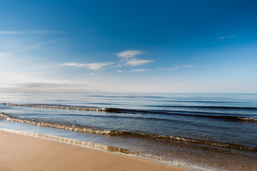 Beautiful light sunset over Baltic sea. Natural background. Latvia. Afterglow, evening calm on the Sea