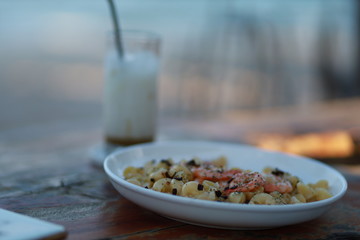 Carbonara Pasta 
shrimp with Cappuccino Coffee by the Sea.