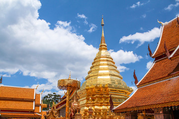 Wat Phra That Doi Suthep with clouds on blue sky in the afternoon, the most famous temple in Chiang Mai, Thailand