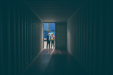 engineer foreman worker opening the doors of a cargo container, view inside the cargo, concept of international logistic industrial with import and export product