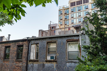 Manhattan, New York, USA - August 29, 2019: High Line Park in Manhattan. View of the surrounding houses and parks. High Line is a popular linear park built on elevated railway tracks