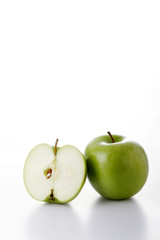 One whole and one half green apples