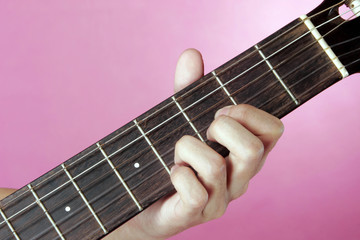 Hand playing guitar