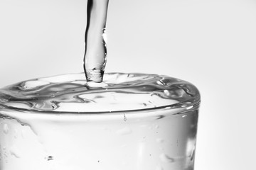 Pouring water into glass