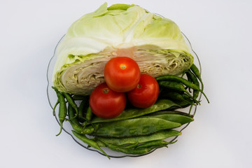 Healthy vegetable food on plate with isolated background. Fresh vegetable top view