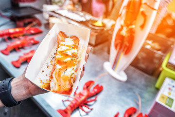 Roasted lobster with cheese at Myeong-dong street food in Seoul, South Korea