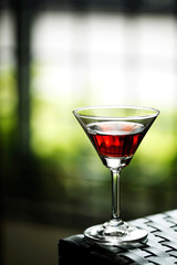 A glass of drink on the table