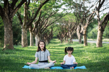 Young girl practicing yoga in the nature.female happiness.