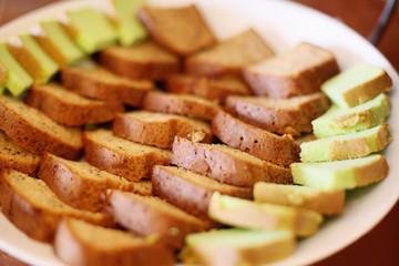 Slices of pandan and chocolate cake