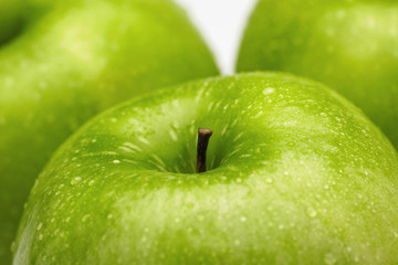 Close-up of green apples with water droplets