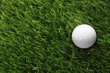 Golf ball placed on grass