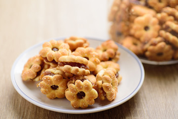 Cracker with pineapple jam (flower shape) on plate, Thai snack	