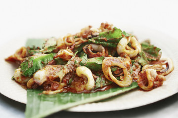 Baked squid with vegetables and spicy sauce