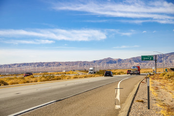 Fototapeta premium Car rides along the Mojave Desert, California