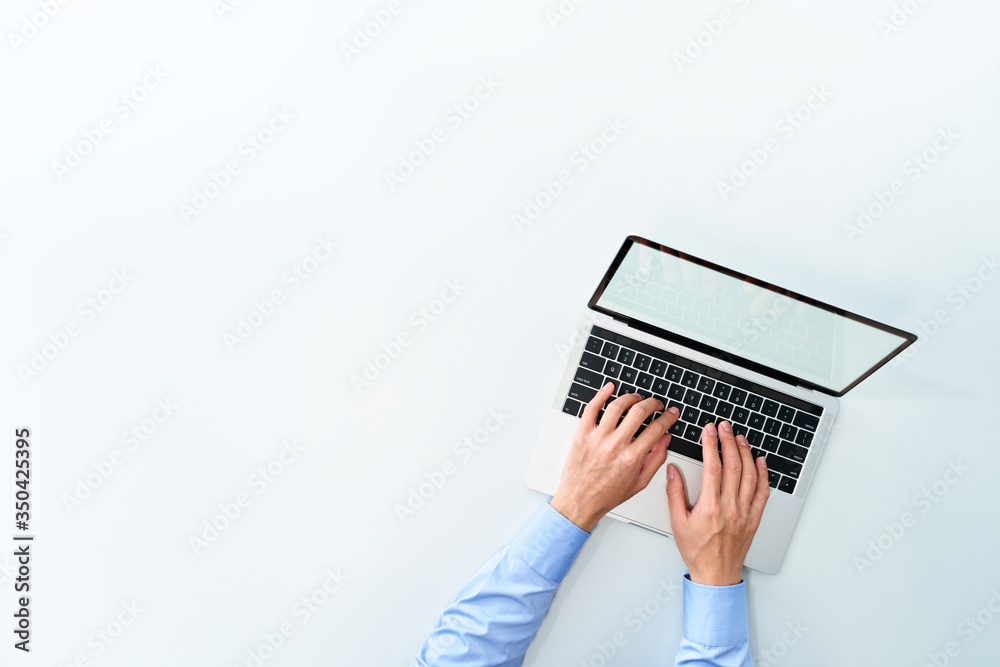 Aufkleber top view of business man using laptop. laptop with blank display on white background.