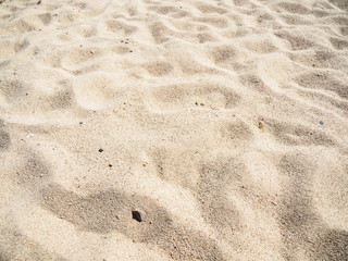 Fototapeta na wymiar Texture of yellow sand, close up view. Abstract background. Egyptian beach in february, Red Sea. Selective soft focus. Blurred background