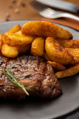 Plate with steak tenderloin and rice with spices ans saffron.