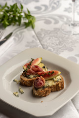 Bruschetta with blue cheese figs and parma ham