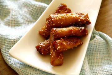 Turon or deep fried saba banana in spring roll wrapper with brown sugar and sesame seeds