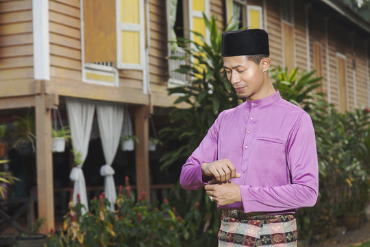 Muslim Man Standing Outside His House